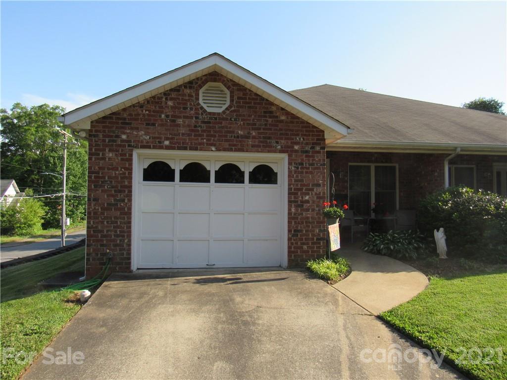 109 Carpenter Lane Rutherfordton, NC 28139 - Photo 1 of 28 a front view of a house with a yard and garage