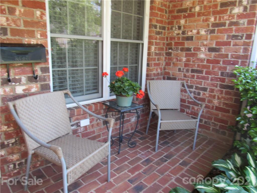 109 Carpenter Lane Rutherfordton, NC 28139 - Photo 2 of 28 a view of a patio with table and chairs and potted plants