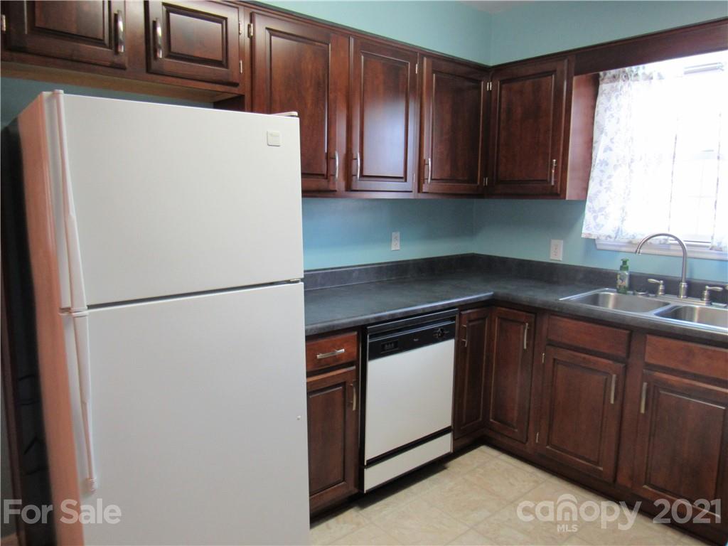 109 Carpenter Lane Rutherfordton, NC 28139 - Photo 11 of 28 a kitchen with stainless steel appliances a refrigerator and sink