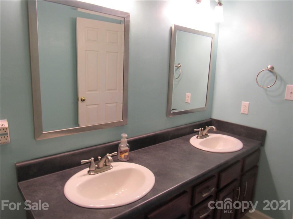 109 Carpenter Lane Rutherfordton, NC 28139 - Photo 17 of 28 a bathroom with a sink and a mirror