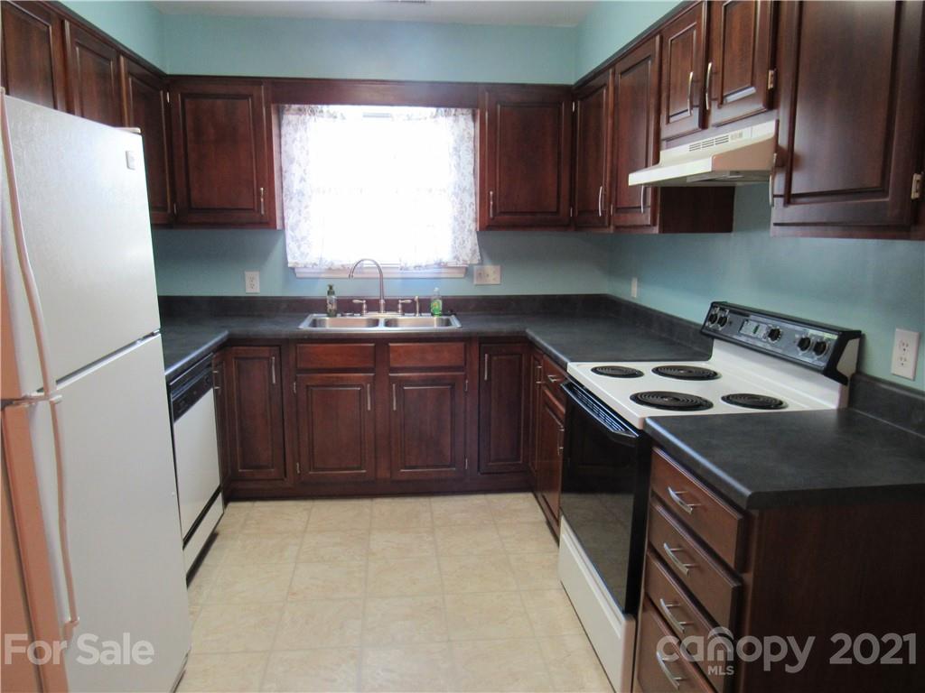 109 Carpenter Lane Rutherfordton, NC 28139 - Photo 9 of 28 a kitchen with a stove a refrigerator and a sink