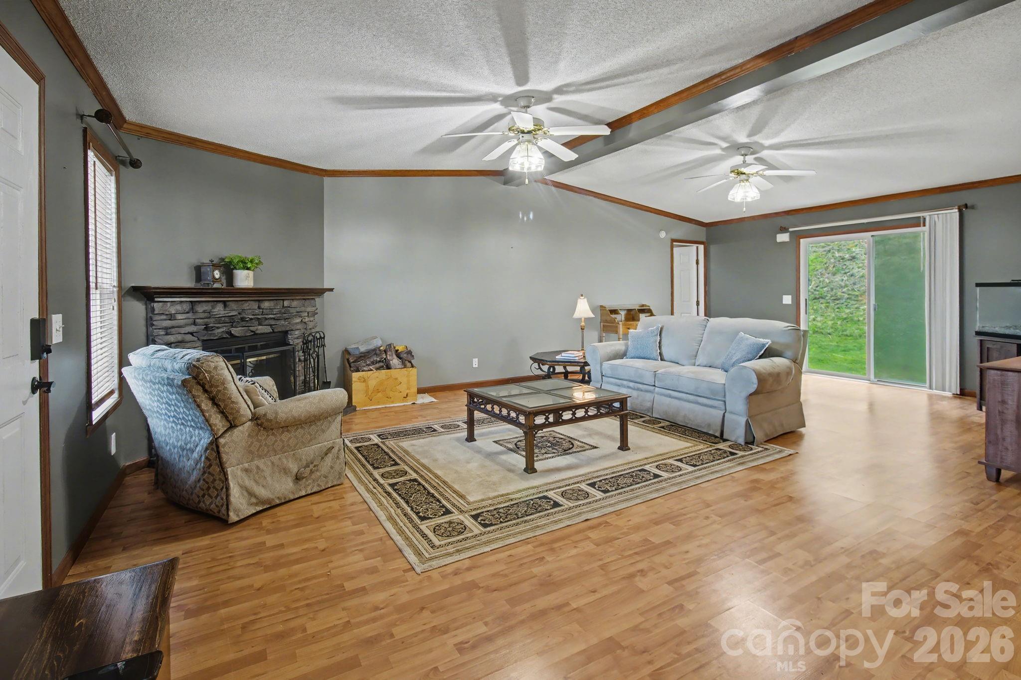 74 Chambers Road Weaverville, NC 28787 - Photo 11 of 43 a living room with furniture and a large window