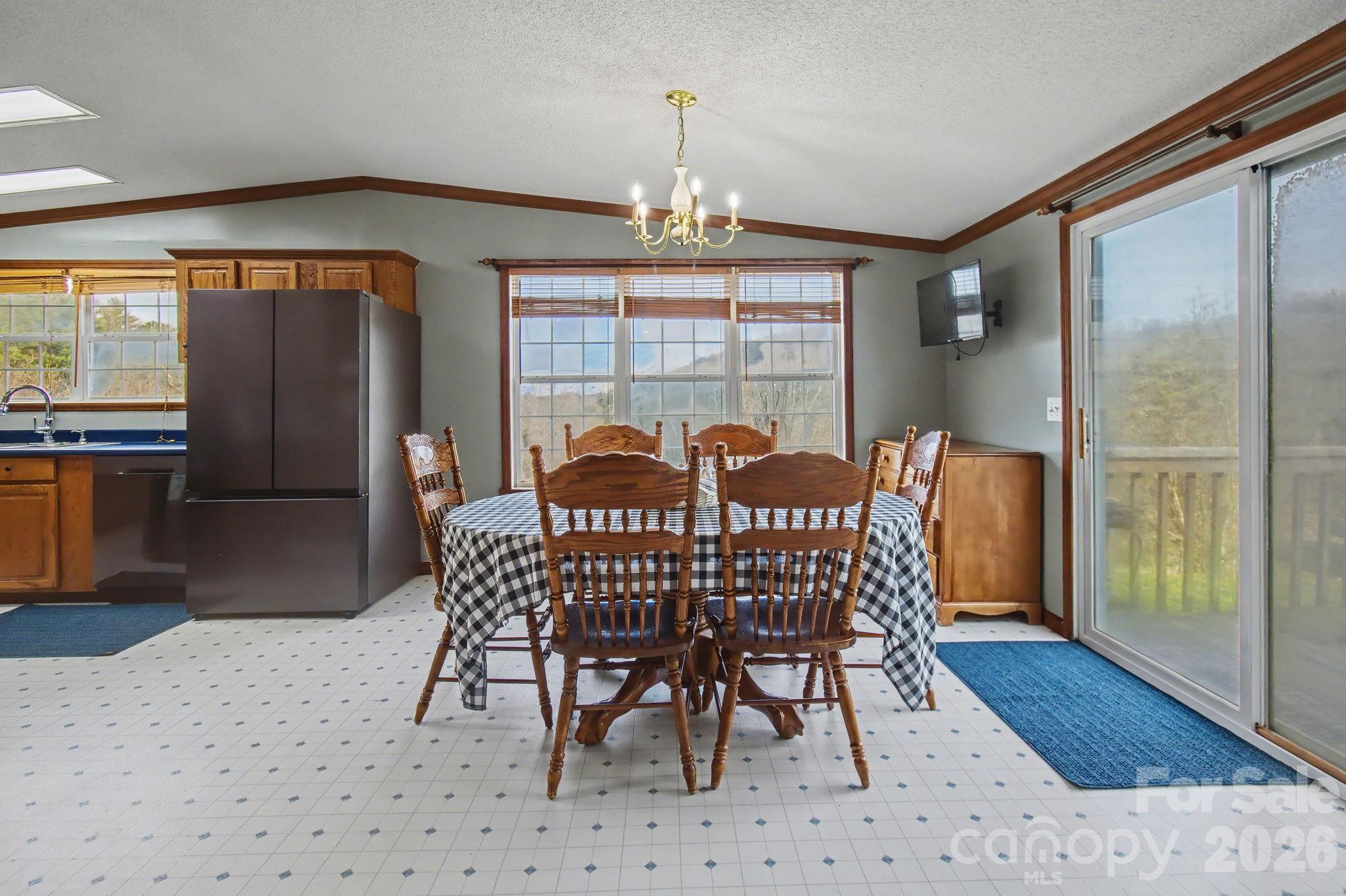 74 Chambers Road Weaverville, NC 28787 - Photo 14 of 43 a view of a dining room with furniture window and wooden floor