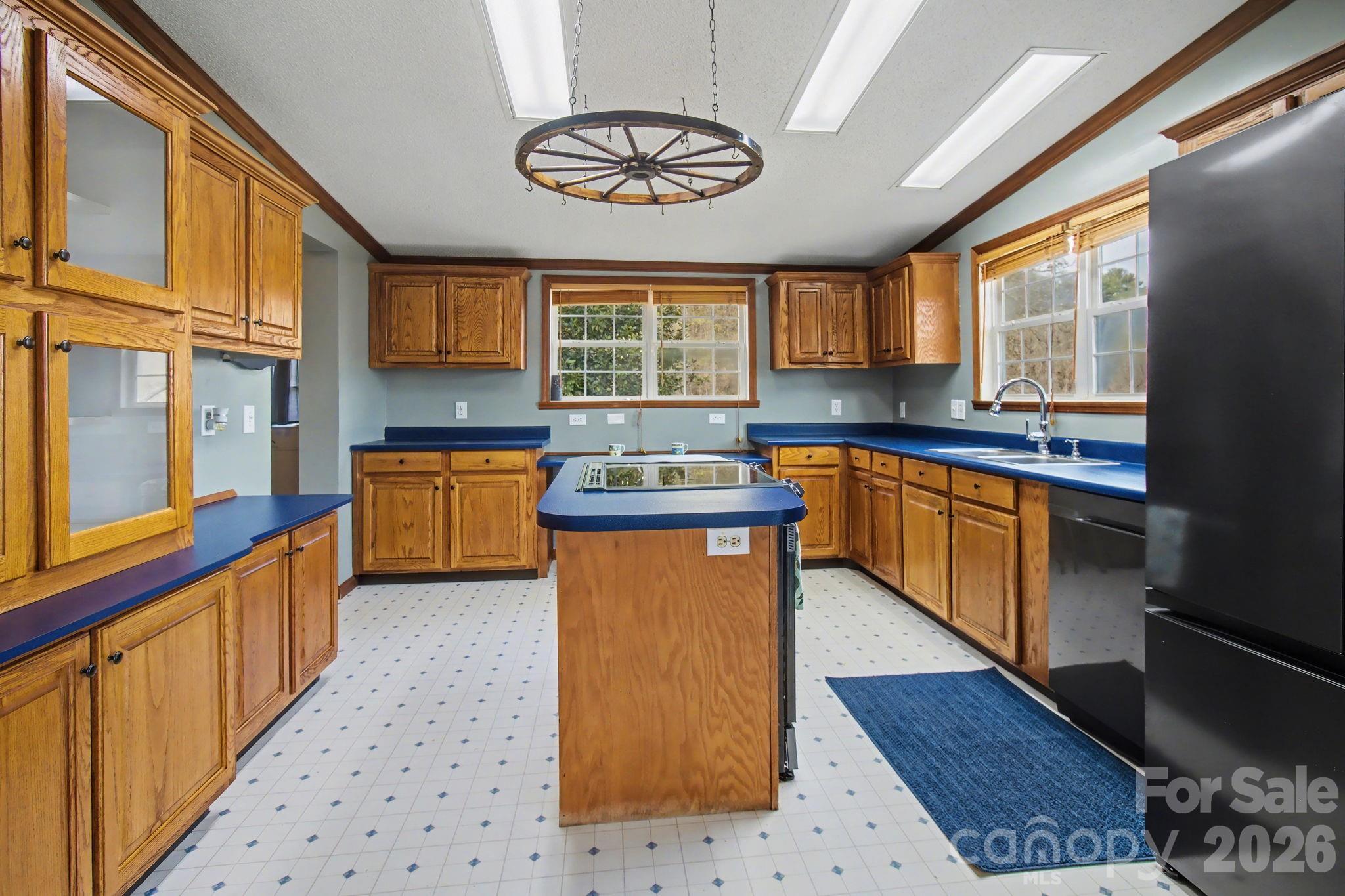 74 Chambers Road Weaverville, NC 28787 - Photo 16 of 43 a kitchen with stainless steel appliances granite countertop a sink stove and refrigerator