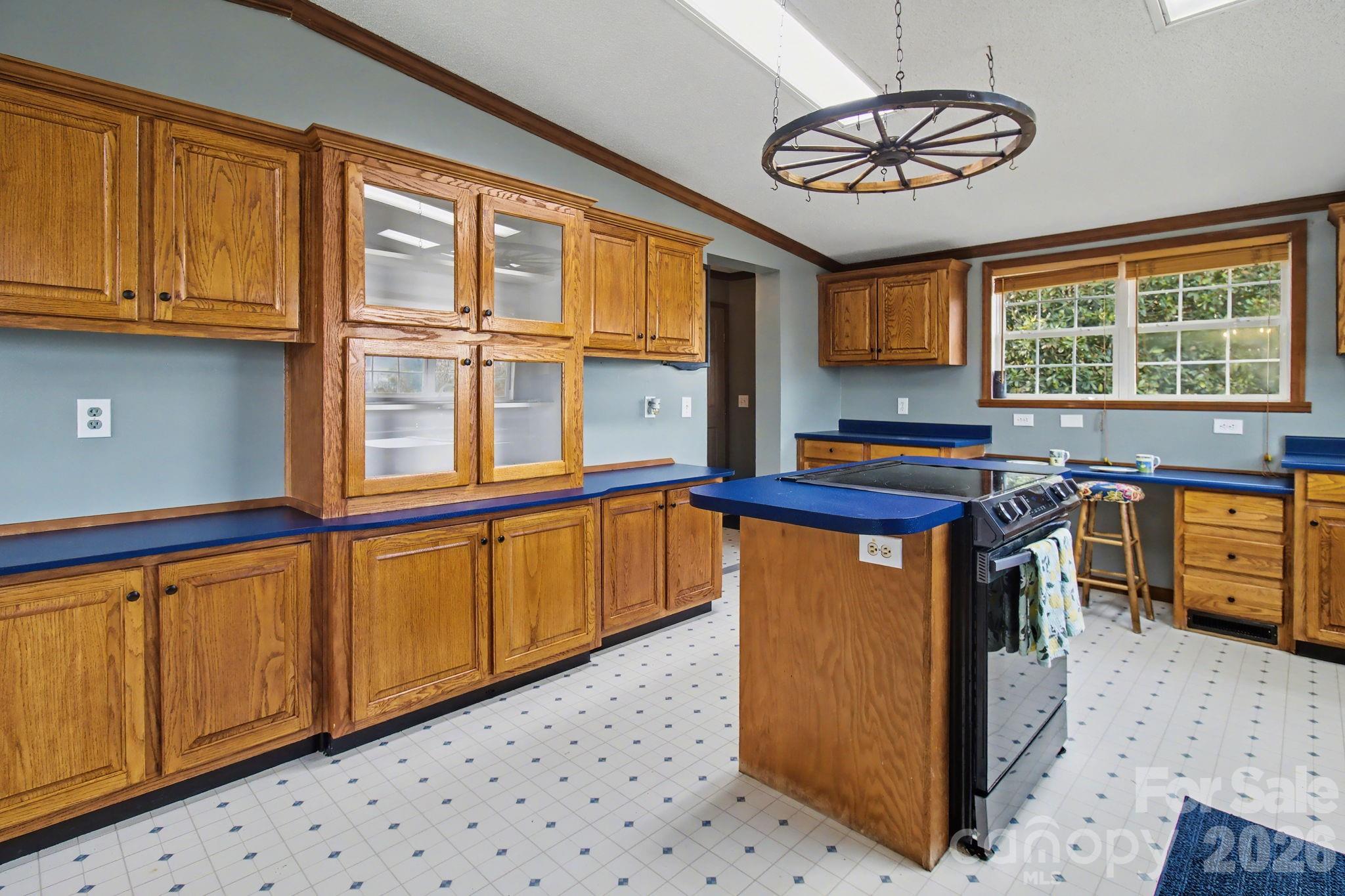 74 Chambers Road Weaverville, NC 28787 - Photo 17 of 43 a kitchen with stainless steel appliances granite countertop a stove a sink and a microwave
