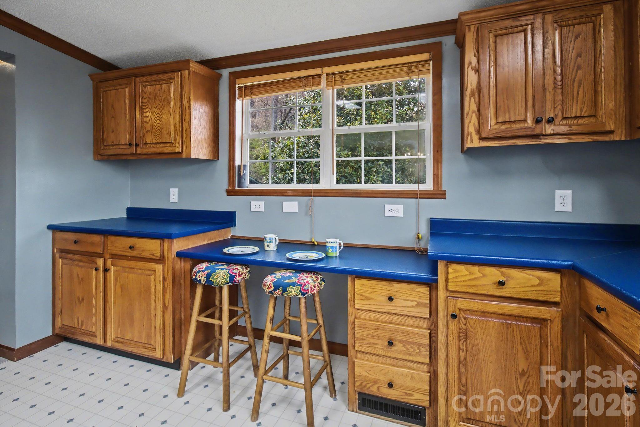 74 Chambers Road Weaverville, NC 28787 - Photo 18 of 43 a kitchen with stainless steel appliances granite countertop a refrigerator and cabinets