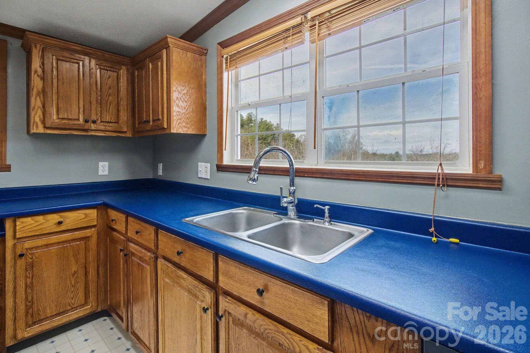 74 Chambers Road Weaverville, NC 28787 - Photo 19 of 43 a kitchen that has a sink and a window in it