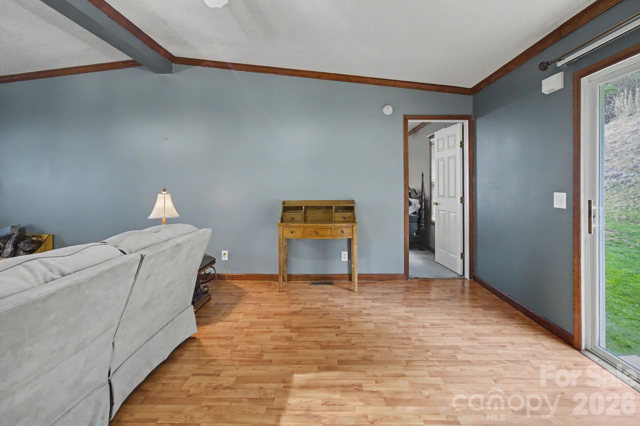 74 Chambers Road Weaverville, NC 28787 - Photo 20 of 43 a view of empty room with wooden floor and fan