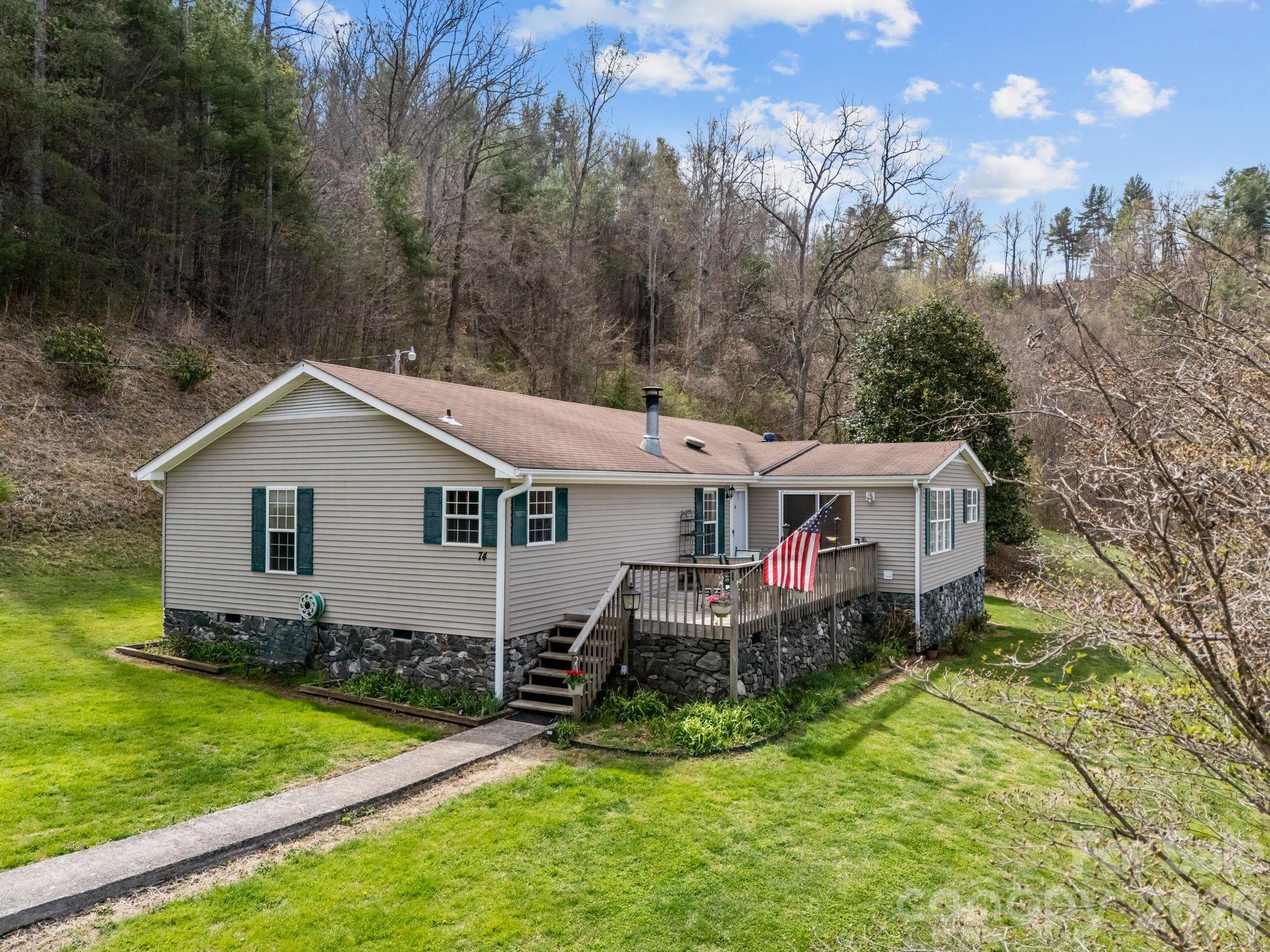 74 Chambers Road Weaverville, NC 28787 - Photo 2 of 43 a view of a house with a yard and sitting area