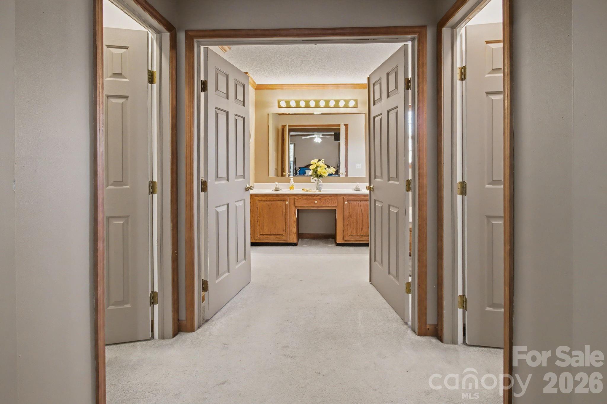 74 Chambers Road Weaverville, NC 28787 - Photo 25 of 43 a en suite bathroom with a granite countertop sink and a mirror