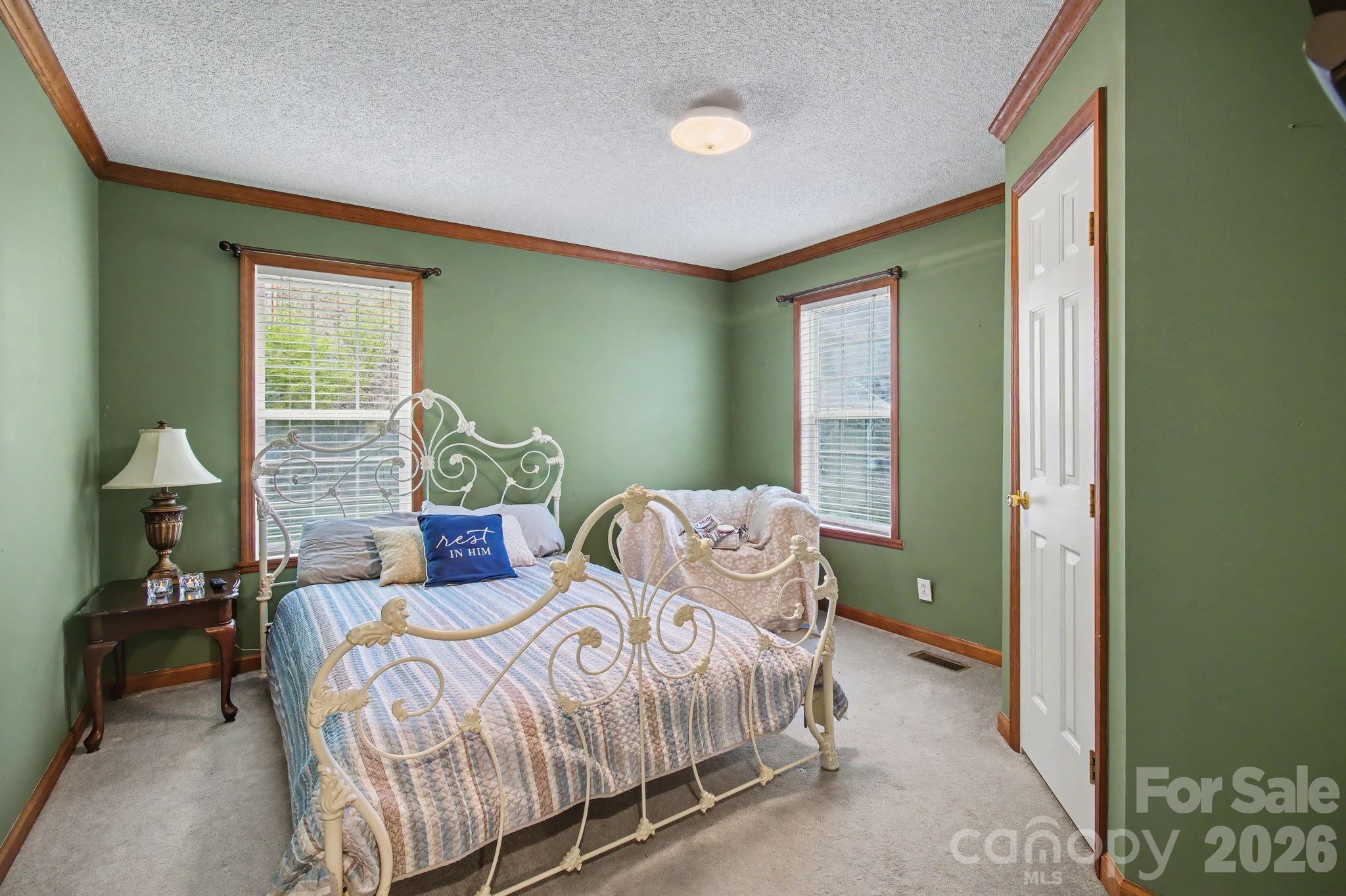 74 Chambers Road Weaverville, NC 28787 - Photo 32 of 43 a bedroom with a bed and a window