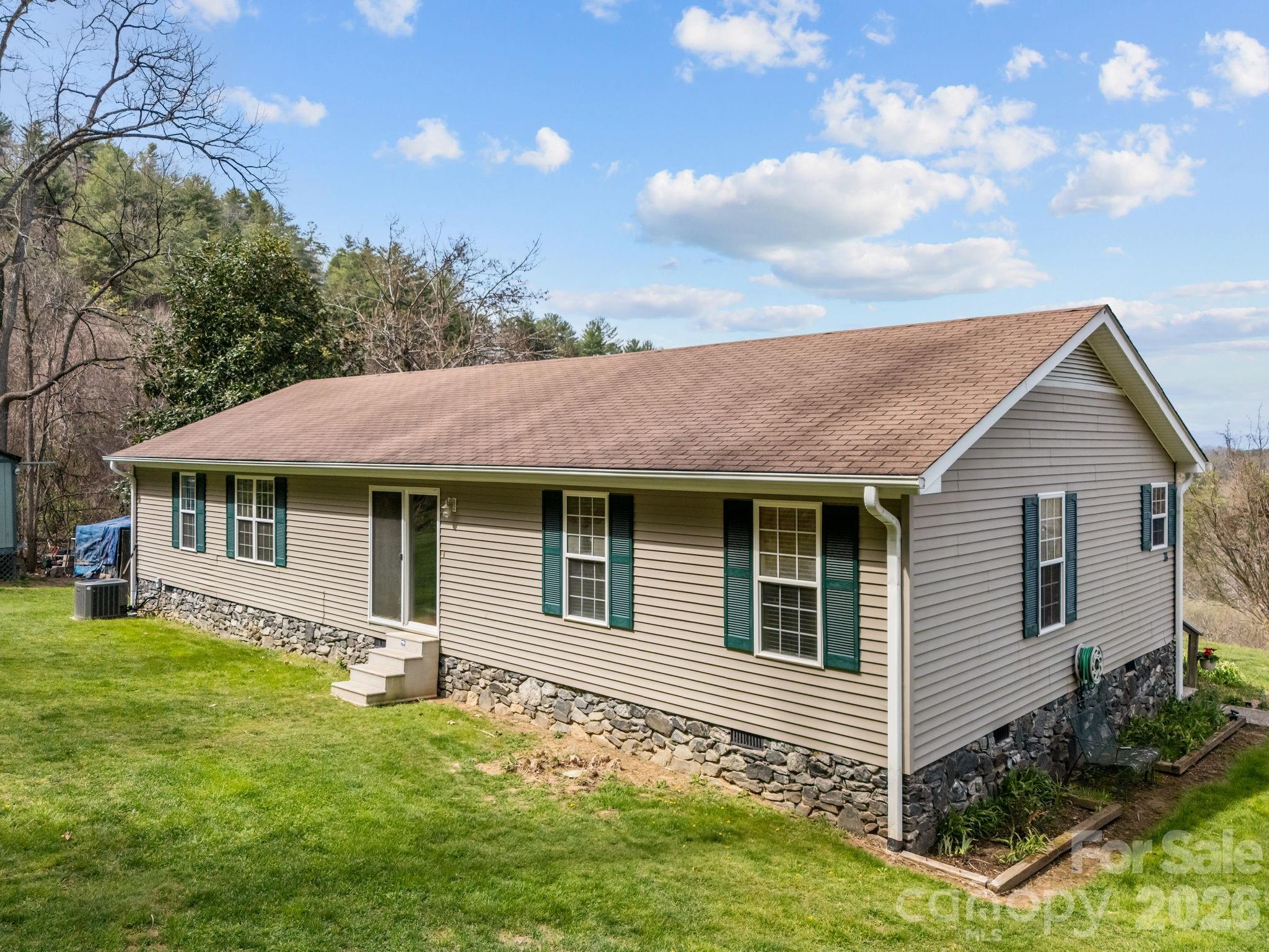 74 Chambers Road Weaverville, NC 28787 - Photo 35 of 43 a view of a house with a yard