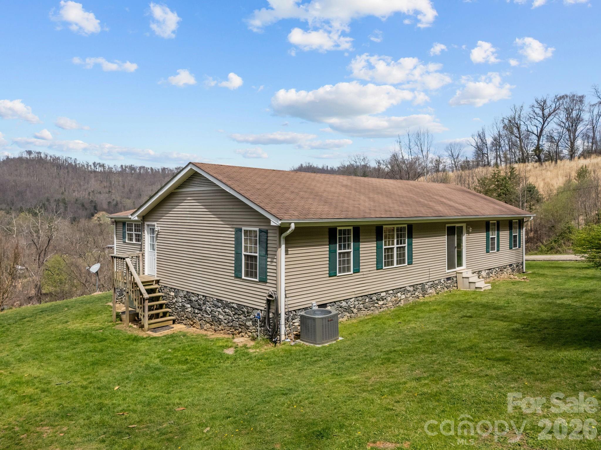 74 Chambers Road Weaverville, NC 28787 - Photo 36 of 43 a view of a house with a backyard