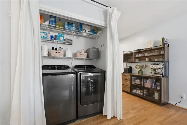 a kitchen with stainless steel appliances granite countertop a refrigerator and a stove