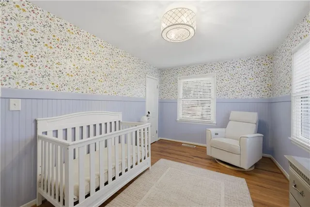 a bedroom with furniture and a window