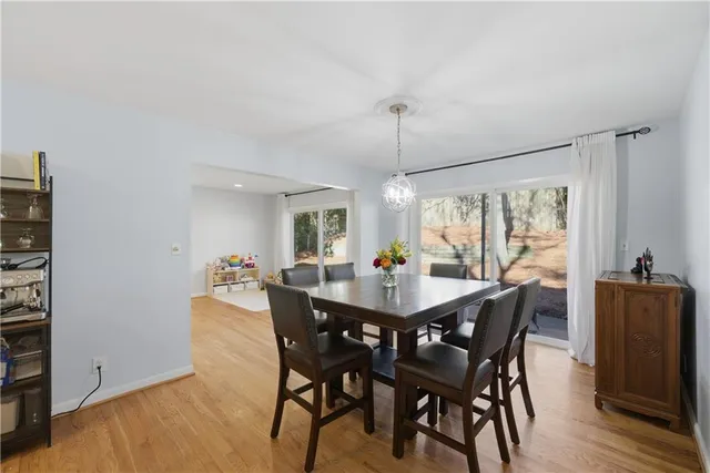 a view of a dining room with furniture window and wooden floor