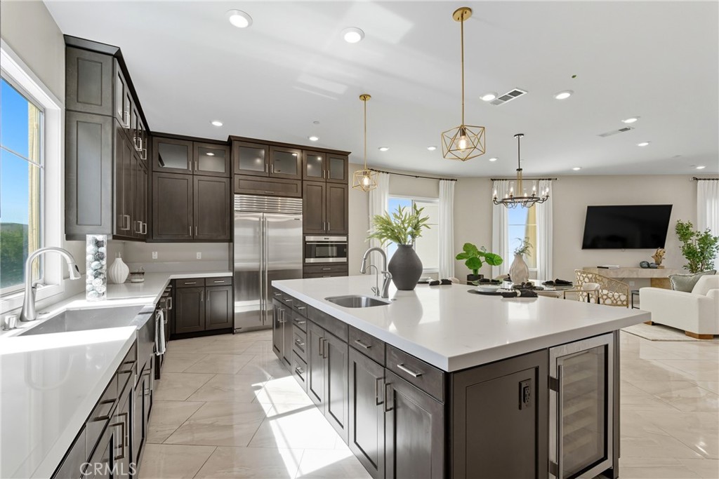 a kitchen with a stove a sink and a refrigerator