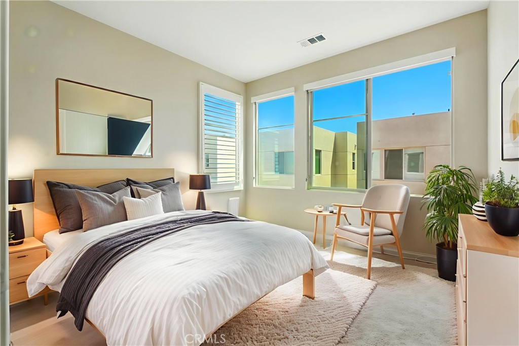 186 Stellar Irvine, CA 92618 - Photo 15 of 46 a bed room with a bed and a chair