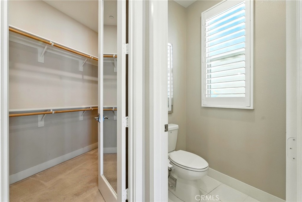 186 Stellar Irvine, CA 92618 - Photo 19 of 46 a bathroom with a toilet and a shower
