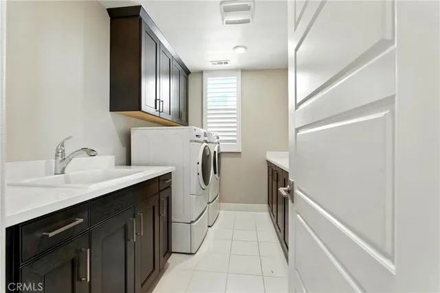 a en suite bathroom with a granite countertop sink and a mirror