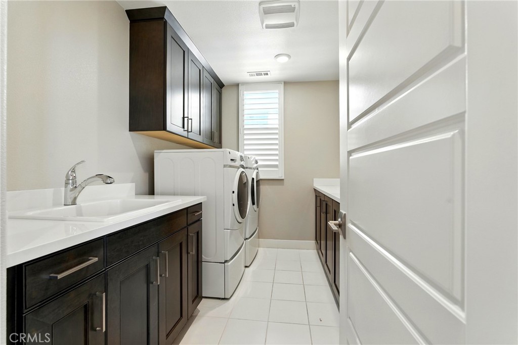 186 Stellar Irvine, CA 92618 - Photo 20 of 46 a en suite bathroom with a granite countertop sink and a mirror