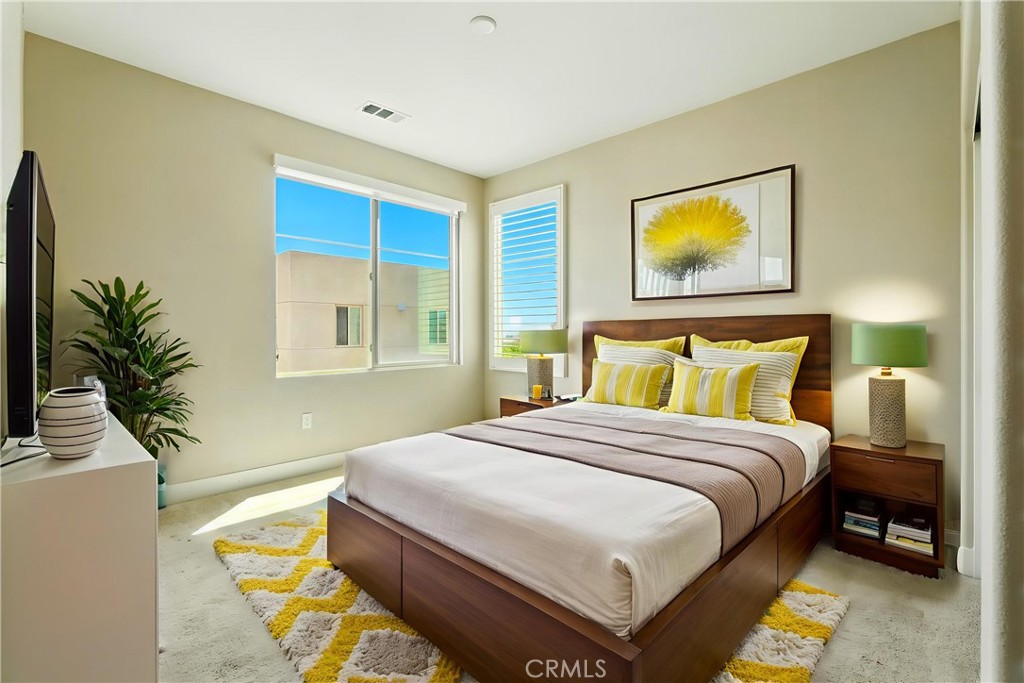 186 Stellar Irvine, CA 92618 - Photo 23 of 46 a bedroom with a bed and a potted plant