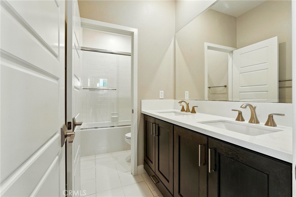 186 Stellar Irvine, CA 92618 - Photo 24 of 46 a bathroom with a double vanity sink mirror and double
