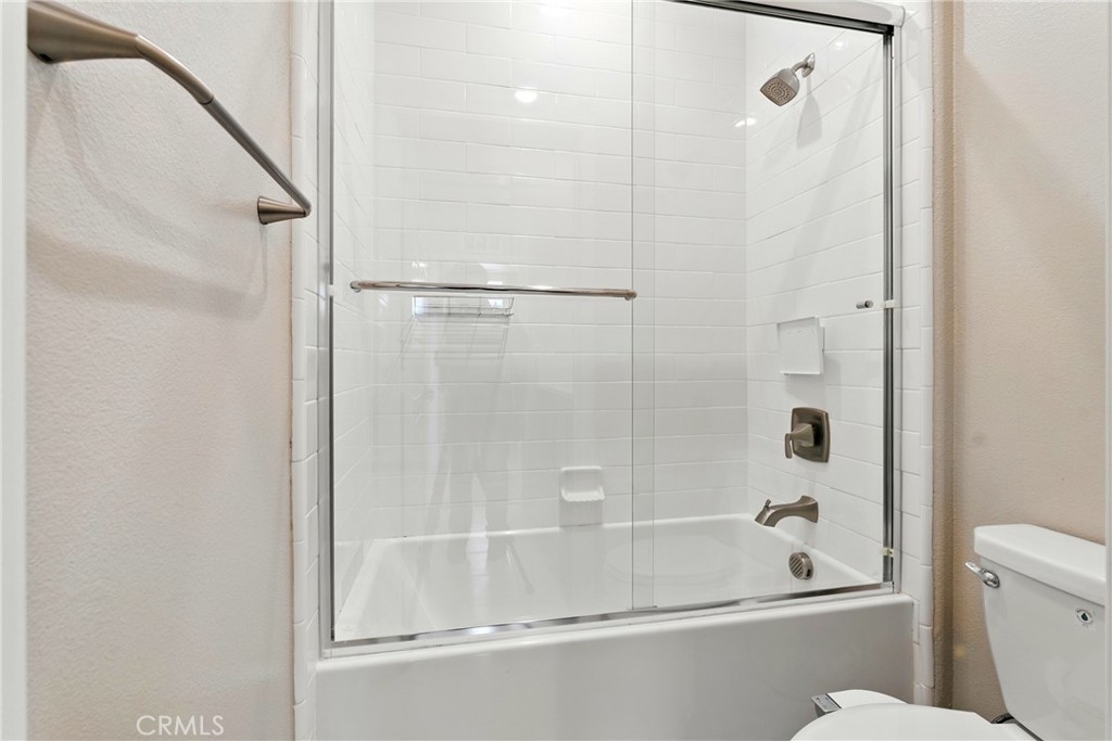 186 Stellar Irvine, CA 92618 - Photo 25 of 46 a bathroom with a glass shower door