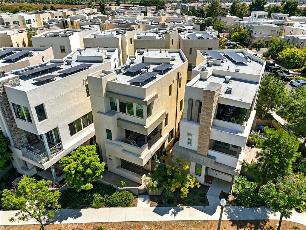 186 Stellar Irvine, CA 92618 - Photo 28 of 46 a picture of a building with a lot of flower plants