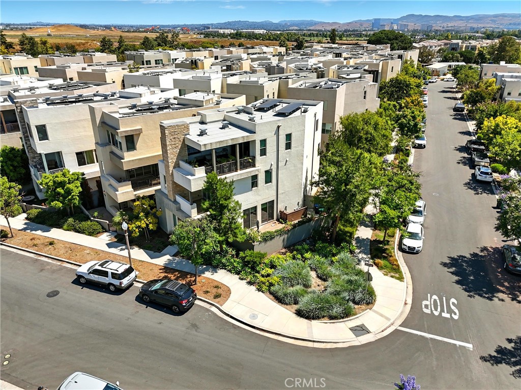 186 Stellar Irvine, CA 92618 - Photo 29 of 46 an aerial view of a house with a garden and lake view