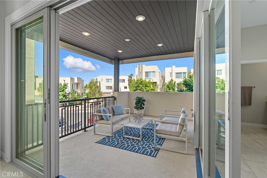 186 Stellar Irvine, CA 92618 - Photo 30 of 46 a living room with large windows