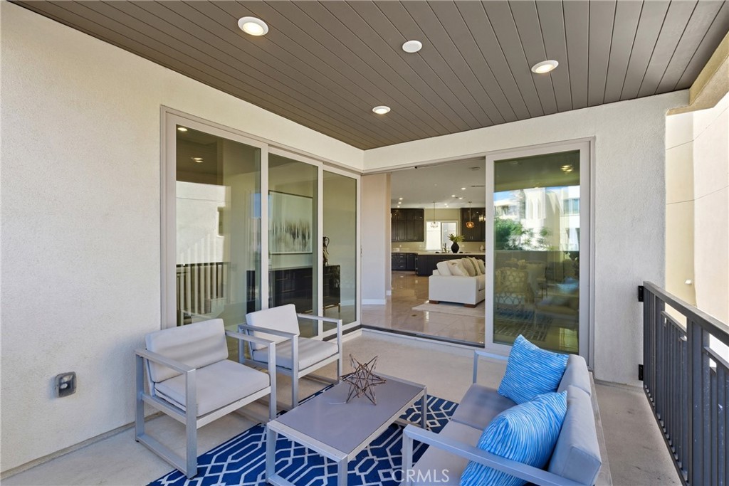 186 Stellar Irvine, CA 92618 - Photo 31 of 46 a living room with furniture and a floor to ceiling window