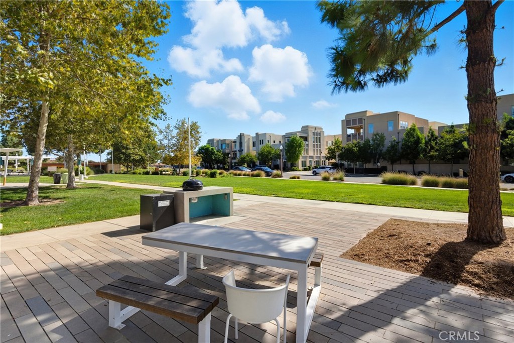 186 Stellar Irvine, CA 92618 - Photo 40 of 46 a patio with table and chairs
