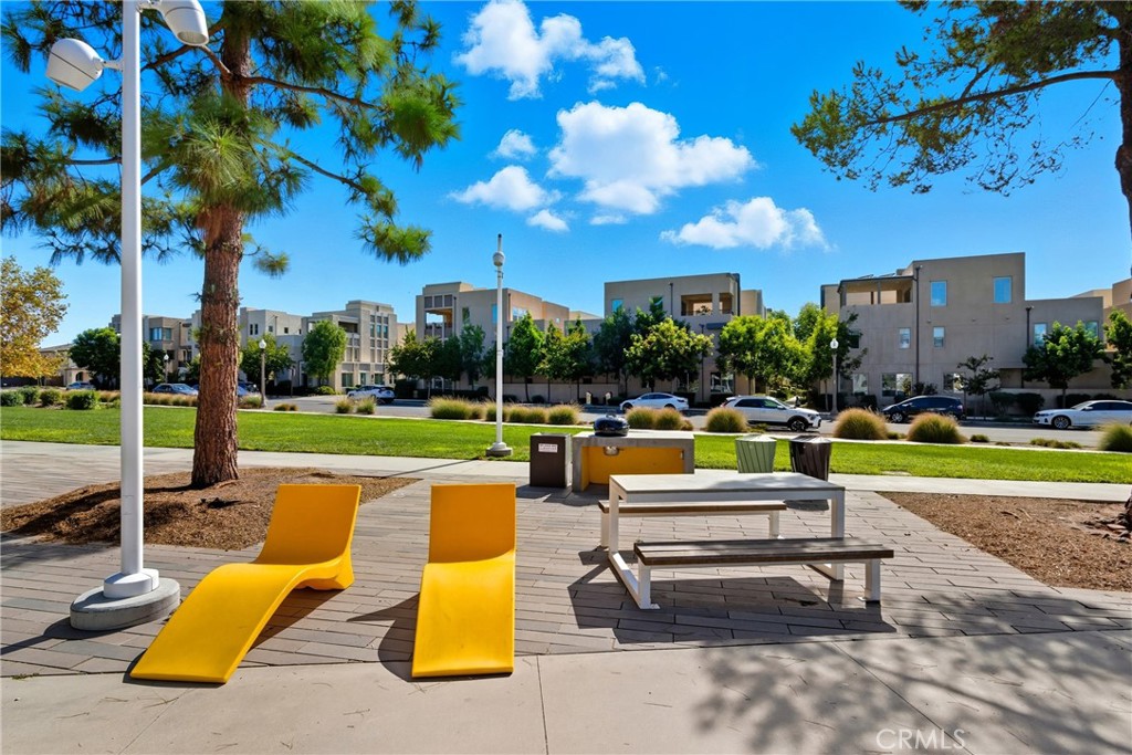 186 Stellar Irvine, CA 92618 - Photo 41 of 46 a swimming pool with outdoor seating and yard