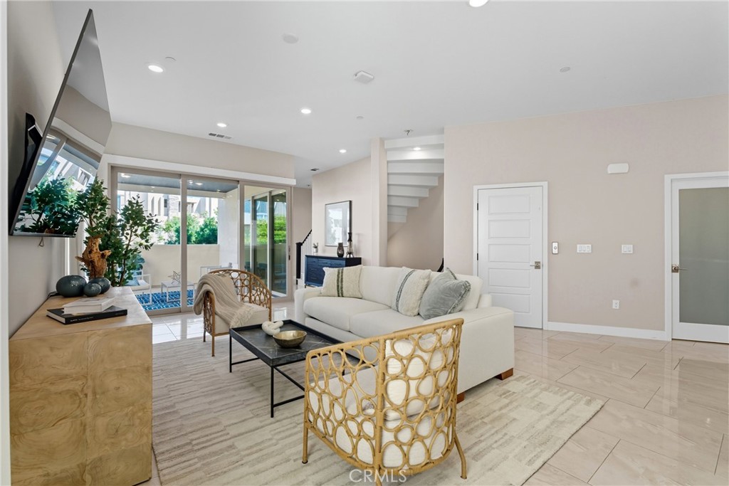 186 Stellar Irvine, CA 92618 - Photo 6 of 46 a living room with furniture and a large window