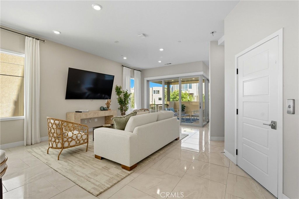 186 Stellar Irvine, CA 92618 - Photo 7 of 46 a living room with furniture and a flat screen tv