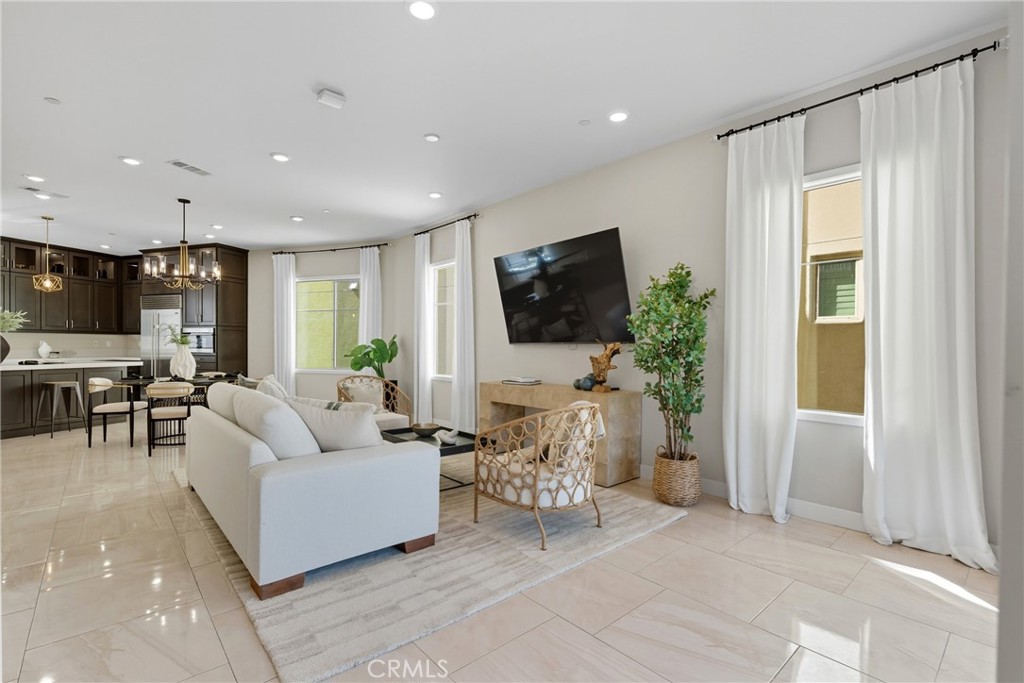186 Stellar Irvine, CA 92618 - Photo 8 of 46 a living room with furniture a flat screen tv and a window