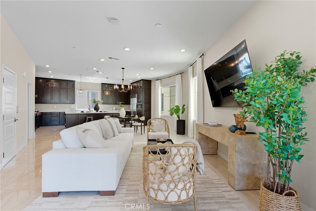 186 Stellar Irvine, CA 92618 - Photo 9 of 46 a living room with furniture a flat screen tv and a potted plant