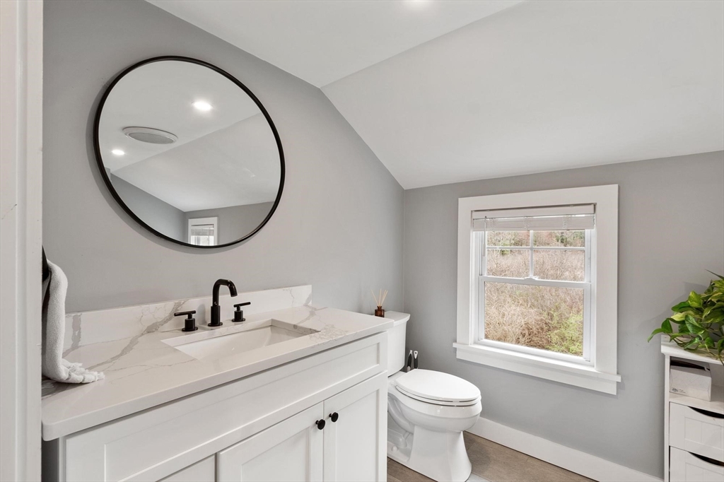 68 Still River Road Harvard, MA 01451 - Photo 29 of 41 a bathroom with a toilet a sink a mirror and a window
