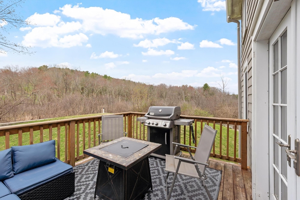 68 Still River Road Harvard, MA 01451 - Photo 34 of 41 a view of a balcony with furniture