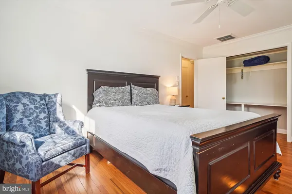a living room with furniture and a dresser