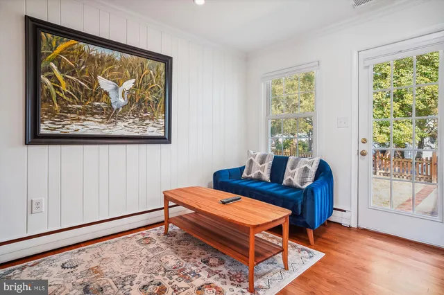 a living room with furniture and a gate