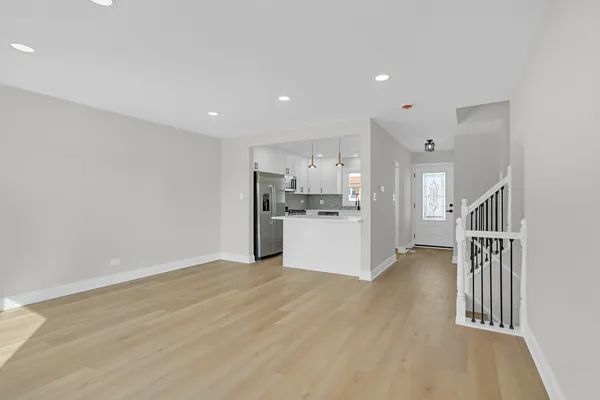 a view of kitchen and wooden floor