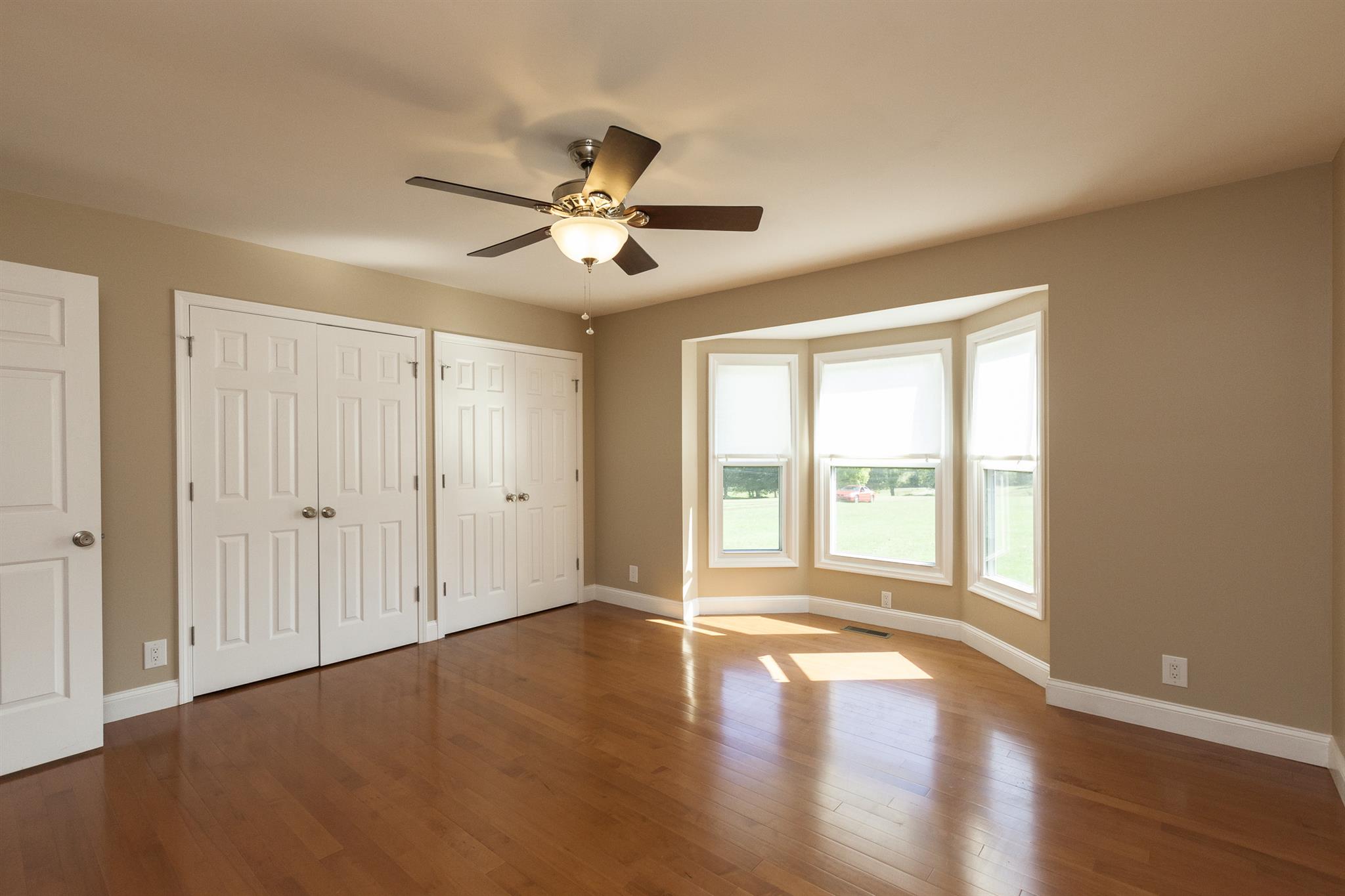 2730 West County Farm Road Springfield, TN 37172 - Photo 16 of 22 a view of an empty room with a window and wooden floor