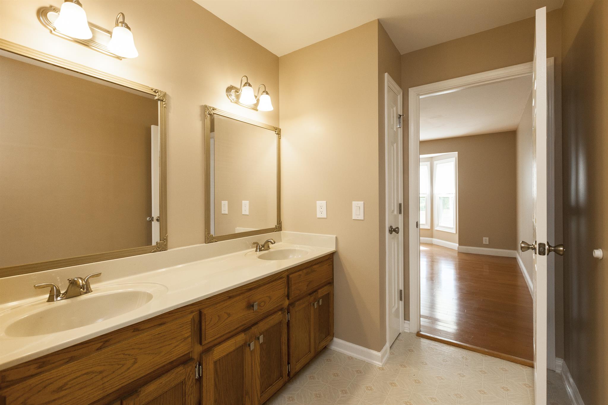 2730 West County Farm Road Springfield, TN 37172 - Photo 17 of 22 a bathroom with a double vanity sink mirror and double