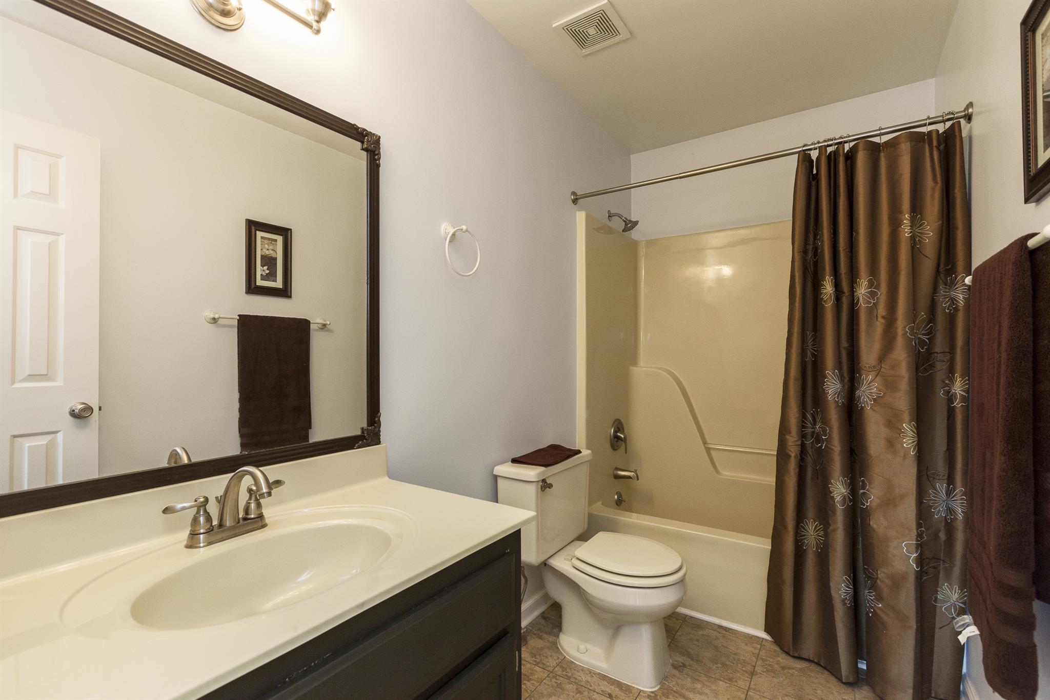 2730 West County Farm Road Springfield, TN 37172 - Photo 20 of 22 a bathroom with a sink a toilet and shower