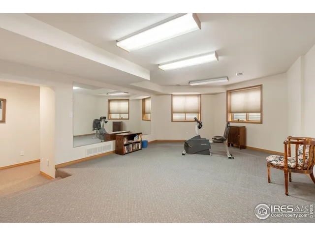 a view of a livingroom with furniture and a window