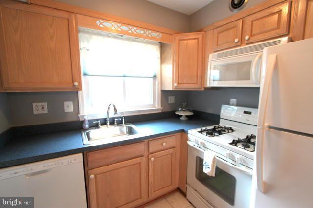 710 West Glebe Road Alexandria, VA 22305 - Photo 8 of 23 a kitchen with granite countertop cabinets stainless steel appliances a sink and a window