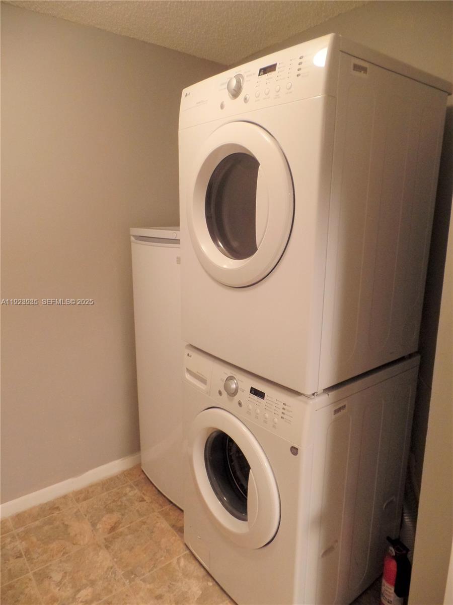 5612 Rock Island Road, Unit 151 Tamarac, FL 33319 - Photo 19 of 26 a utility room with dryer and washer