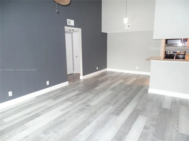 a view of a kitchen with a dishwasher and a refrigerator